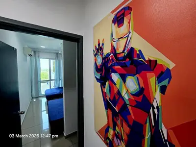 a painting of a superhero on the wall in a room at Marvel Nest- 3bedroom-Poolview-10pax in Bukit Mertajam