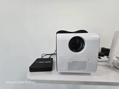 a speaker sitting on a table with a charger at Marvel Nest- 3bedroom-Poolview-10pax in Bukit Mertajam
