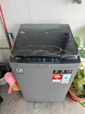a fax machine with a plastic cover on top of it at Casa for 8 ipoh Central Pet Allowed in Ipoh