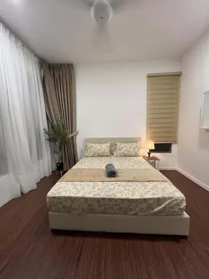 a bedroom with a large bed in a room at Shahiqa Palas Horizon Residence in Cameron Highlands
