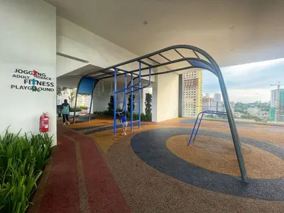 a playground in a building with a blue structure at Le Jardin Suite 8 Pax Sea View Infinity Pool in George Town