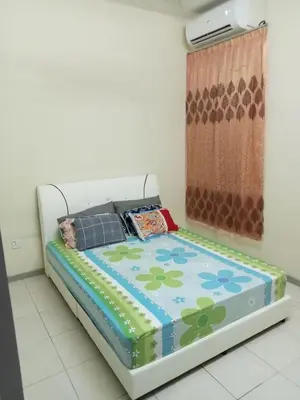 a bed in a room with a flower patterned mattress at Hani Homestayz2U in Kuala Lipis
