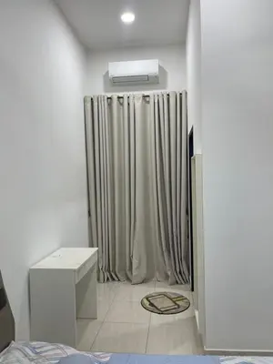 a room with a shower with a curtain at Nafisa Homestay in Kepala Batas