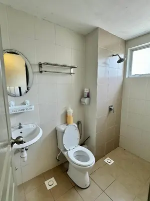 a bathroom with a toilet and a sink at Ayaan Bliss Homestay at QuintetTanahRata in Cameron Highlands