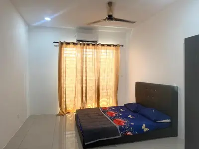 a bedroom with a bed in front of a window at Classic Home Stay in Kuala Ketil