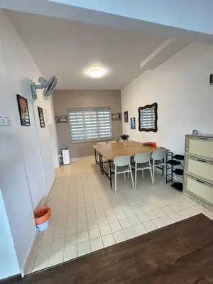 a kitchen and dining room with a table and chairs at Fraser's Haven SilverparkResort Walk down 8 steps in Bukit Fraser