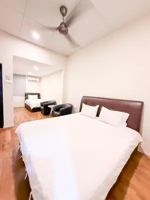 a bedroom with a large white bed in a room at ComfortCottage Ipoh Coliving & Whole Unit in Ipoh