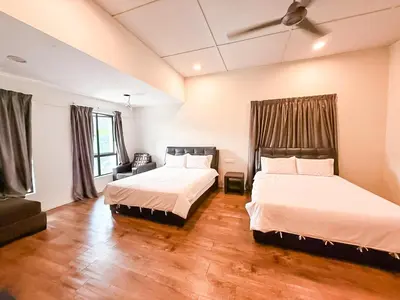 a bedroom with two beds and a ceiling fan at ComfortCottage Ipoh Coliving & Whole Unit in Ipoh