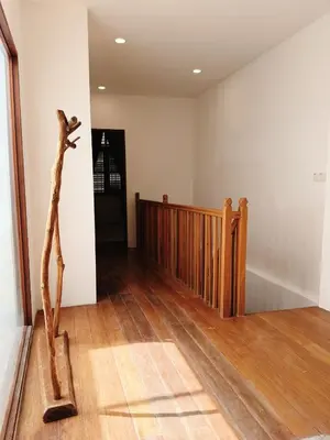 a room with a wooden staircase and a wooden floor at Courtyard by Heritage Row in George Town