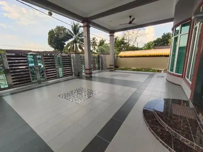 an empty porch with a view of a house at SUN HOMESTAY Teluk Intan