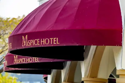 a purple hotel sign on the side of a building at M Spice Hotel Seberang Jaya in Perai