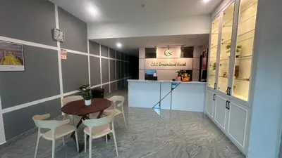 a restaurant with a table and chairs and a counter at C&CDreamland hotel in Ipoh