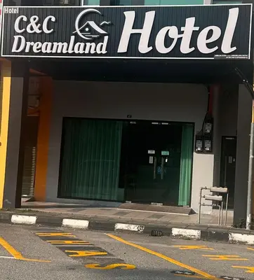 a hotel sign on the front of a building at C&CDreamland hotel in Ipoh