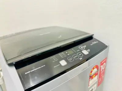 a microwave oven sitting on top of a machine at Breathtaking Sea View Penang Bridge 2BR in Bayan Lepas