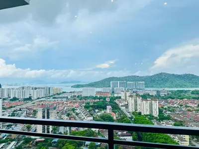 a view of a city from a balcony at Romantic Sea & Penang Bridge View Luxury 2BR in Bayan Lepas