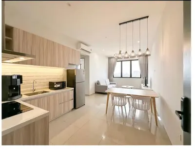 a kitchen with a table and chairs in a room at dream sweet home bayan lepas iconic netflix usm in Bayan Lepas
