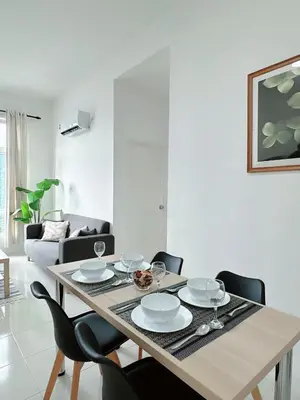 a dining room with a table and chairs at The Anderson Cozy Deluxe Homestay in Ipoh