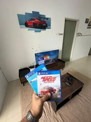 a person holding up a video game box at AYAAN GAMING ARENA at Tanah Rata Cameron Highland in Tanah Rata