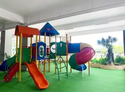 a playground with a slide and a slideintend at Peace HomestayThe Venus Sitiawan in Sitiawan