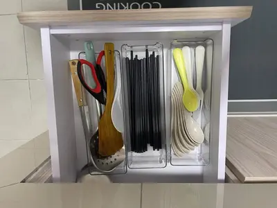 a plastic container filled with utensils in a kitchen at Peace HomestayThe Venus Sitiawan in Sitiawan