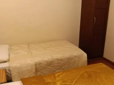 a small room with two beds in a room at Hotel Remix 2 Cameron Highlands in Gua Sai