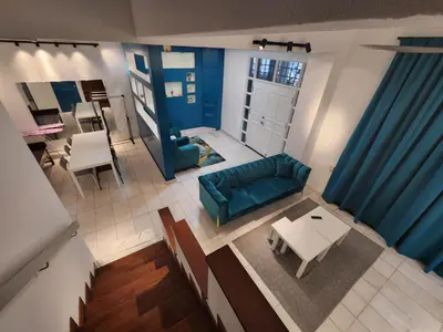 an overhead view of a living room with a blue couch at Gurney Vacation Gathering Comfy Home - Solok Burma in George Town