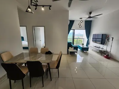 a dining room and living room with a table and chairs at Horizon Rooftop Skypool Condotel - Ipoh in Ipoh