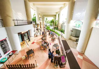 an overhead view of a lobby with people sitting at tables at Penang Rainbow Paradise in Tanjung Bungah
