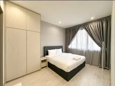 a bedroom with a bed and a large window at Wanderlust Retreat 1R by Iconic Regency in Bayan Lepas