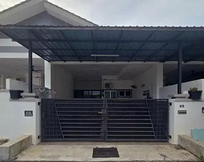 a house with awning over the front gate at Naryan Homestay Teluk Batik in Lumut