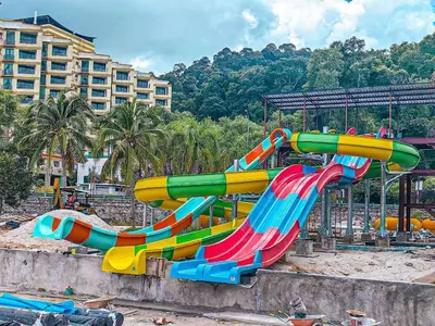 a colorful water slide in a playground at Naryan Homestay Teluk Batik in Lumut