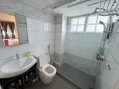 a bathroom with a toilet and a sink and a shower at The Nest Retreat, B7-3A-1 2BR Family Suite in Bukit Fraser