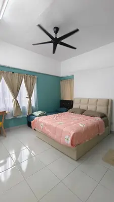 a bedroom with a bed and a ceiling fan at Hygge Living Kampar III Near UTAR in Kampar