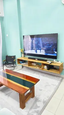 a living room with a large flat screen tv at Hygge Living Kampar III Near UTAR in Kampar