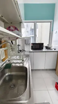 a kitchen with a stainless steel sink in a kitchen at Hygge Living Kampar III Near UTAR in Kampar