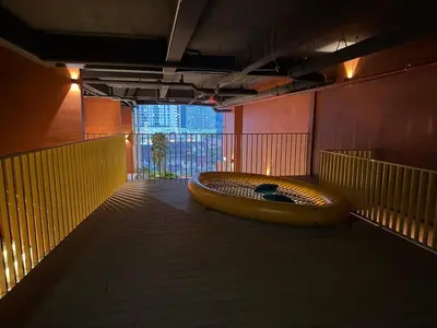 a room with a large brown object on the floor at The Minty Nest - Piccadilly Residence Ipoh with Infinity Pool in Ipoh