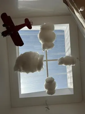 a window with clouds in a room with a plane at Morikoi Cottage in Ipoh