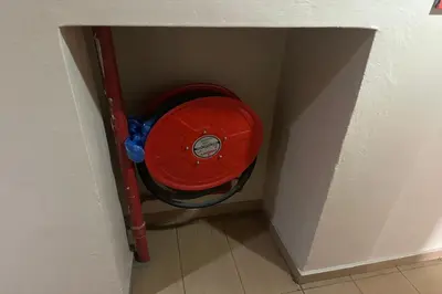 a red object in the corner of a room at Hotel Titiwangsa in Gua Sai