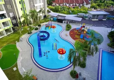 an overhead view of a large swimming pool with a water park at Ipoh Manhattan Condo, Pengkalan 4br12pax in Ipoh