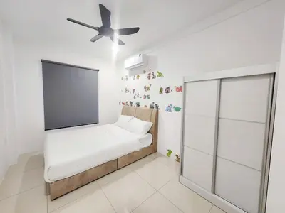 a small bedroom with a bed and a ceiling fan at Ipoh Manhattan Condo, Pengkalan 4br12pax in Ipoh
