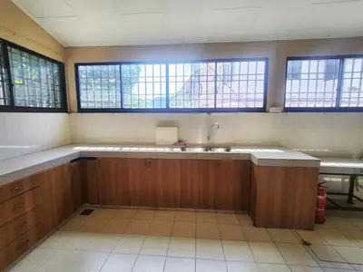 an empty kitchen with a sink and windows at Ipoh sunway lostworld 5br 15pax in Tambun