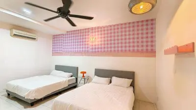 a bedroom with two beds and a ceiling fan at IPOH PRIVATE POOL VILLA 6BR 23pax in Ipoh