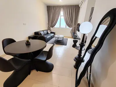 a living room with a table and a couch at BW Urban Stay in Ipoh