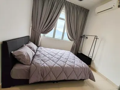 a bedroom with a bed and a large window at BW Urban Stay in Ipoh