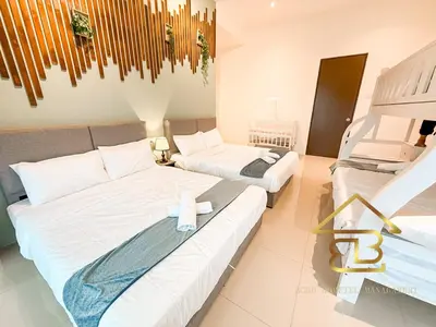 a bedroom with two beds and a chandelier at Ipoh Fairy Villa 3 Pool, Jacuzzi & KTV 23 Pax in Ipoh