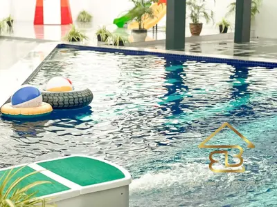 a swimming pool with a ball and balls in it at Ipoh Fairy Villa 3 Pool, Jacuzzi & KTV 23 Pax in Ipoh