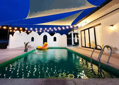 a swimming pool with a inflatablelatable at Deer Farm Pool Villa 5BR 27pax by One Life Four Season Guesthouse in Tanjung Rambutan