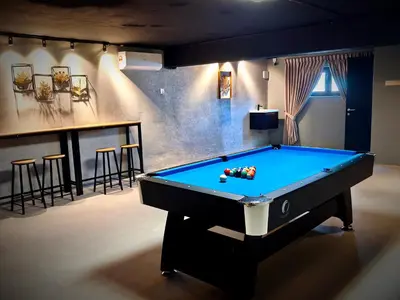 a billiard room with a pool table and a bar at Deer Farm Pool Villa 5BR 27pax by One Life Four Season Guesthouse in Tanjung Rambutan