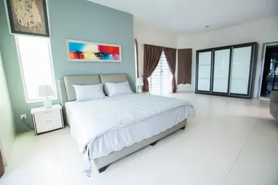 a bedroom with a large bed in a room at Ipoh Sky Pool Villa, 20 Pax with Kbox, Gym & BBQ in Ipoh