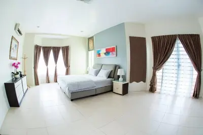 a bedroom with a bed and two windows at Ipoh Sky Pool Villa, 20 Pax with Kbox, Gym & BBQ in Ipoh